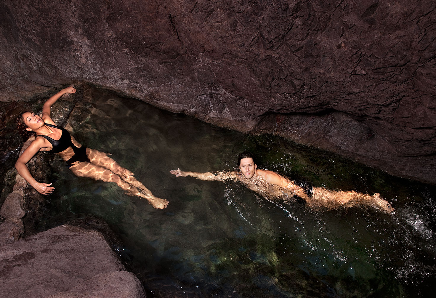 Couple relax in hot spring