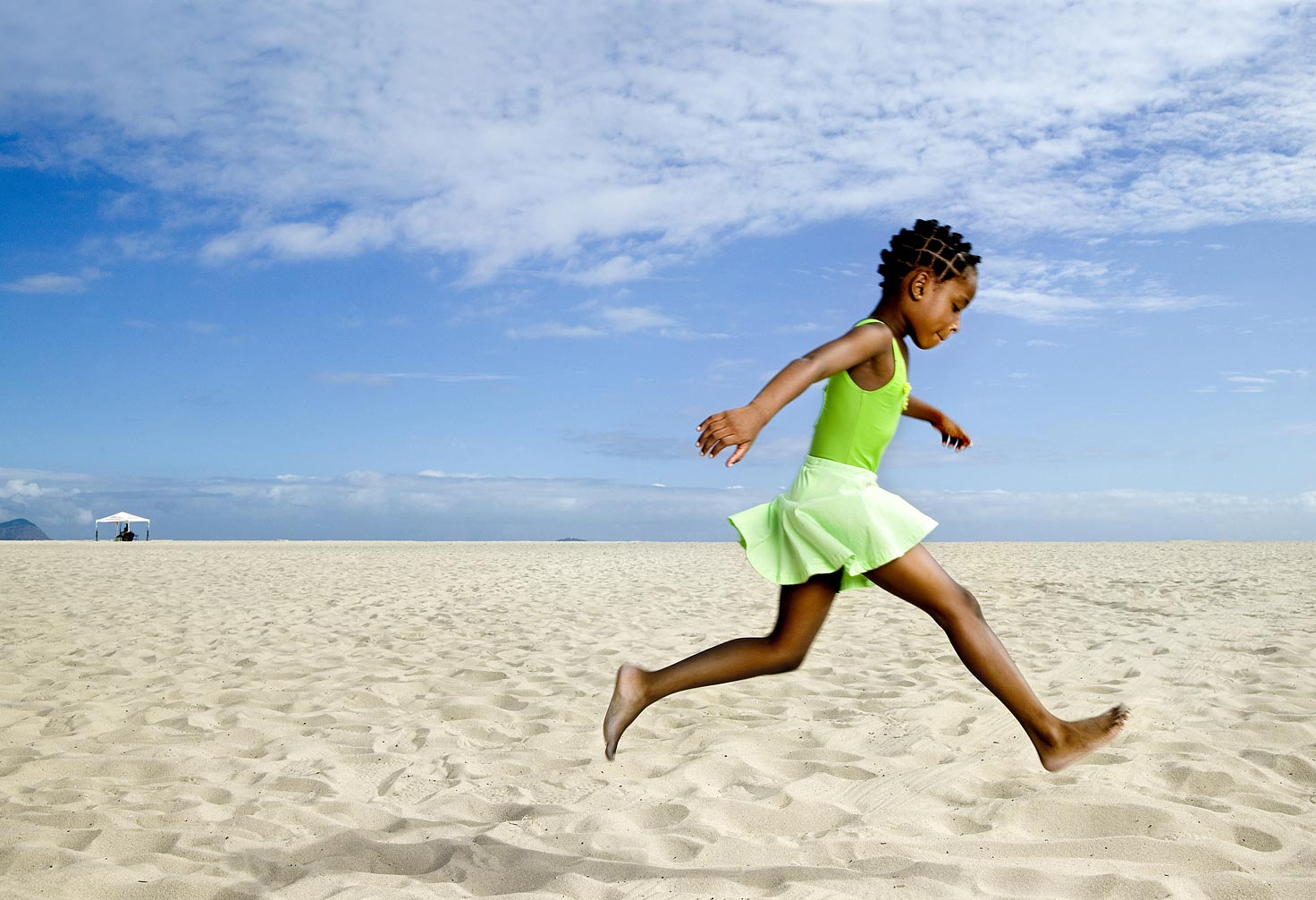 joSon childhood-Girl jumping at the beach